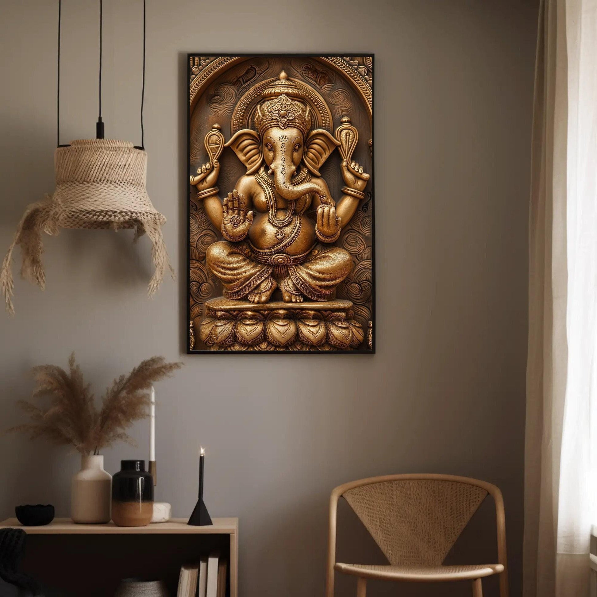 a golden statue of a ganeshh hanging on a wall