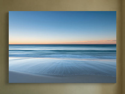 Ocean horizon at dusk canvas wall art, serene beach scene at sunset, with the calm ocean meeting the sky in a beautiful