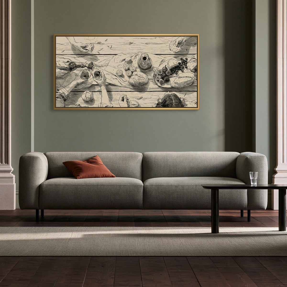 Dinner party table sketch canvas wall art, gray sofa with a red throw pillow, and a wooden coffee table in front of it.