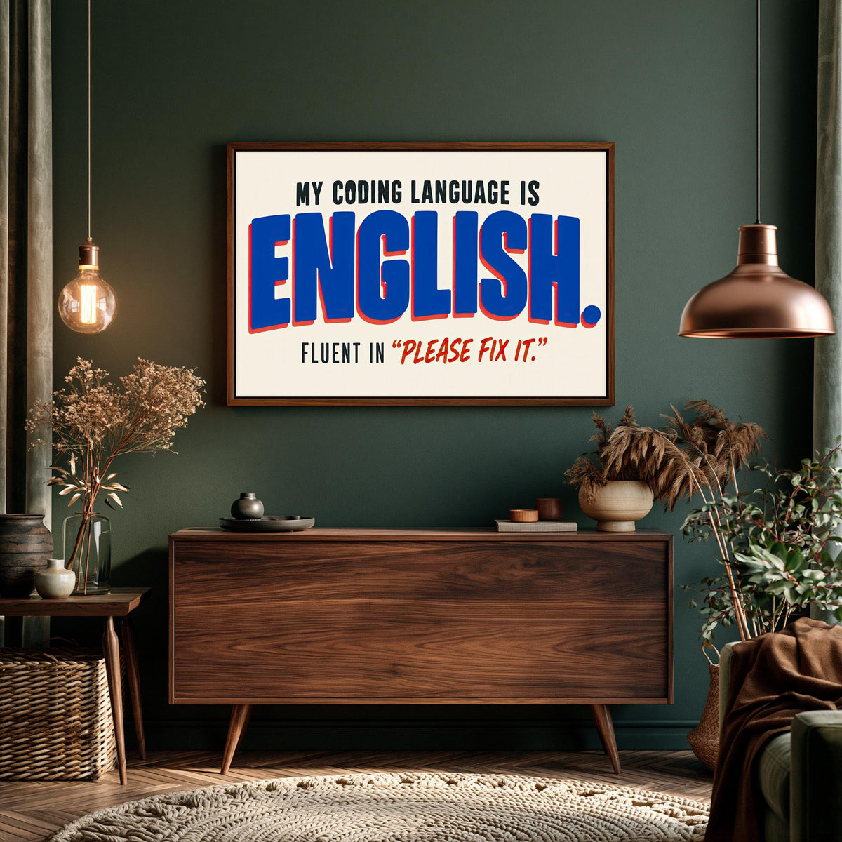 a wooden dresser with a framed quote on the wall above it, which reads "MY CODING LANGUAGE IS ENGLISH. FLUENT IN "PLEASE FIT IT""