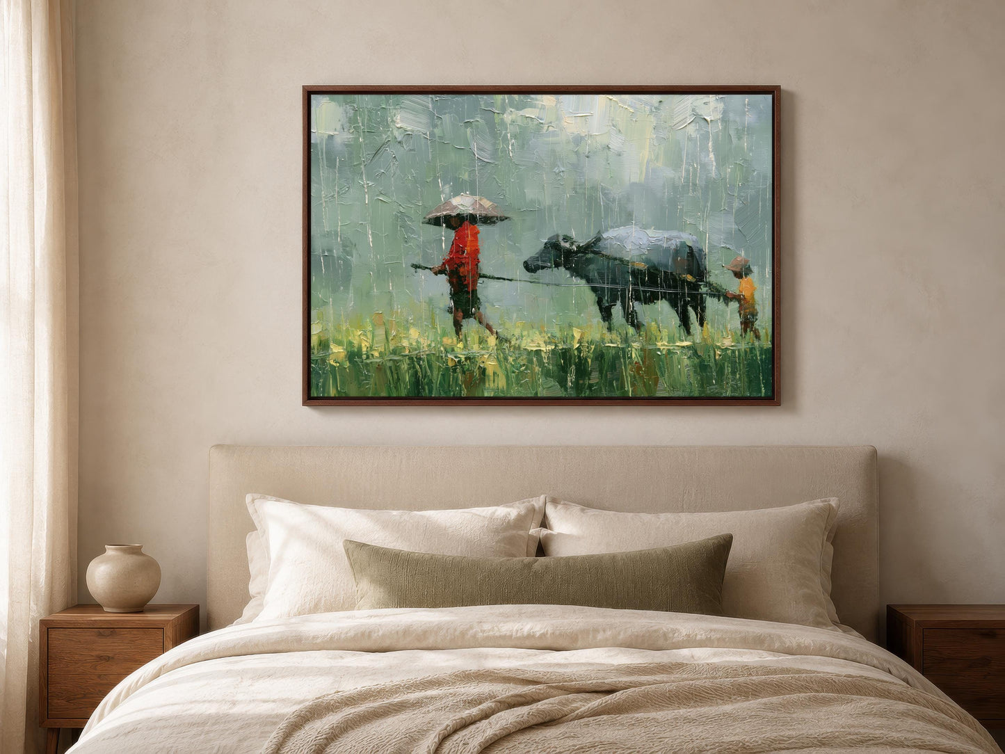 a person walking with an umbrella and a cow in a field, with a painting hanging on the wall above a bed with white pillows.