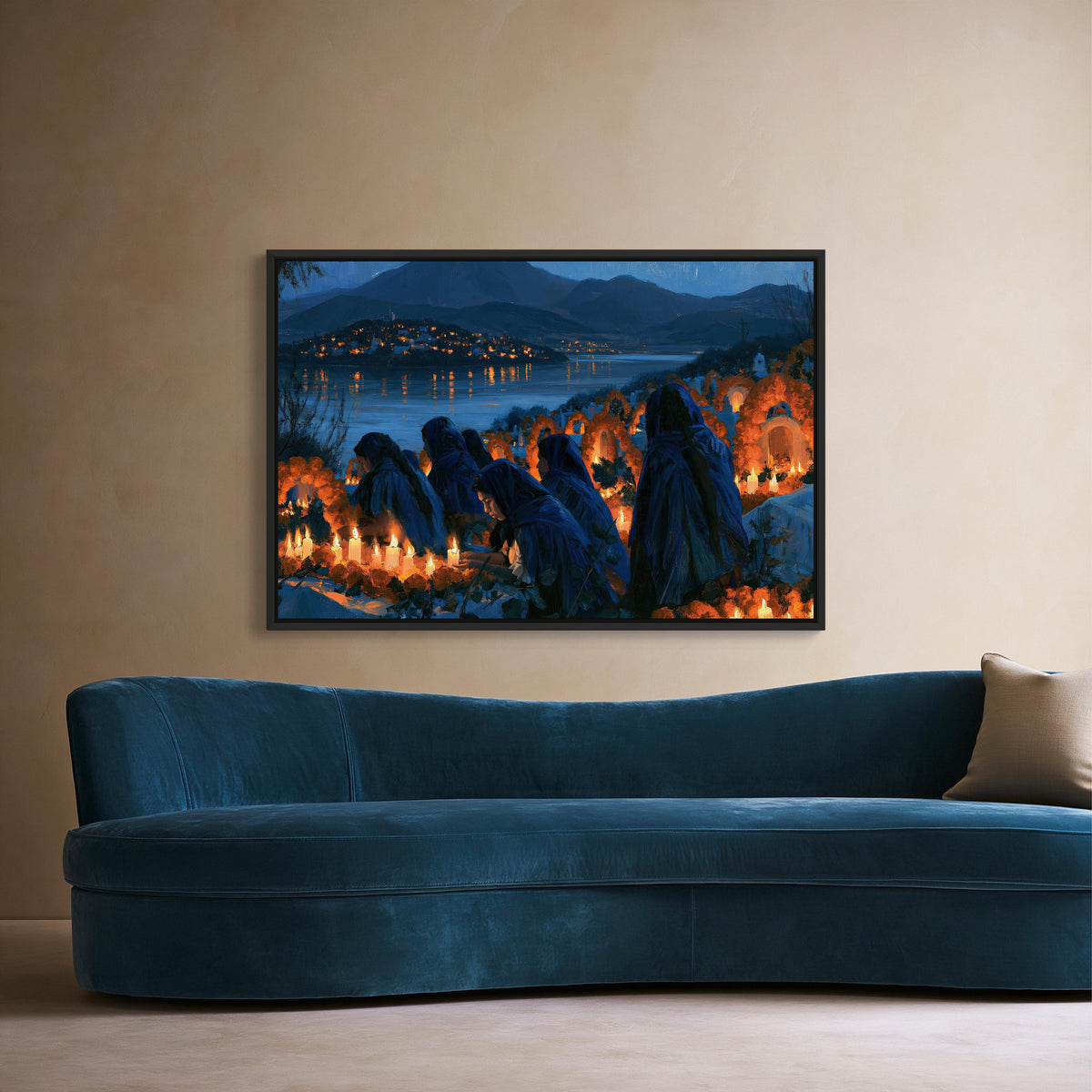 Day of the Dead candlelit vigil canvas wall art, blue couch against a beige wall, with a framed painting of a nighttime