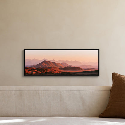Red desert mountains at sunset canvas wall art, framed landscape painting hanging on a wall above a white couch