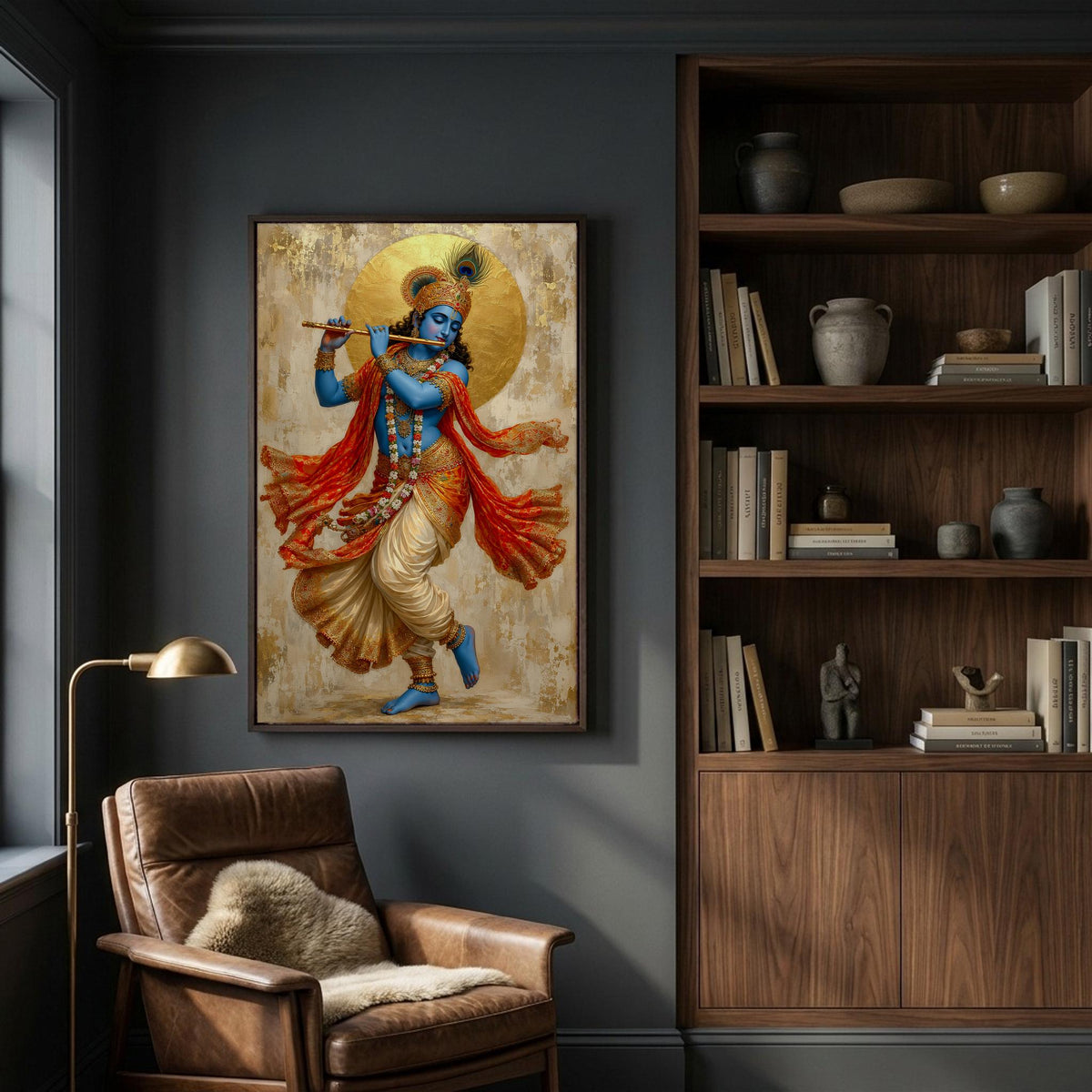 a framed painting of a Hindu deity, likely a depiction of Krishna, hanging on a wall in a room with a bookshelf and a leather chair.