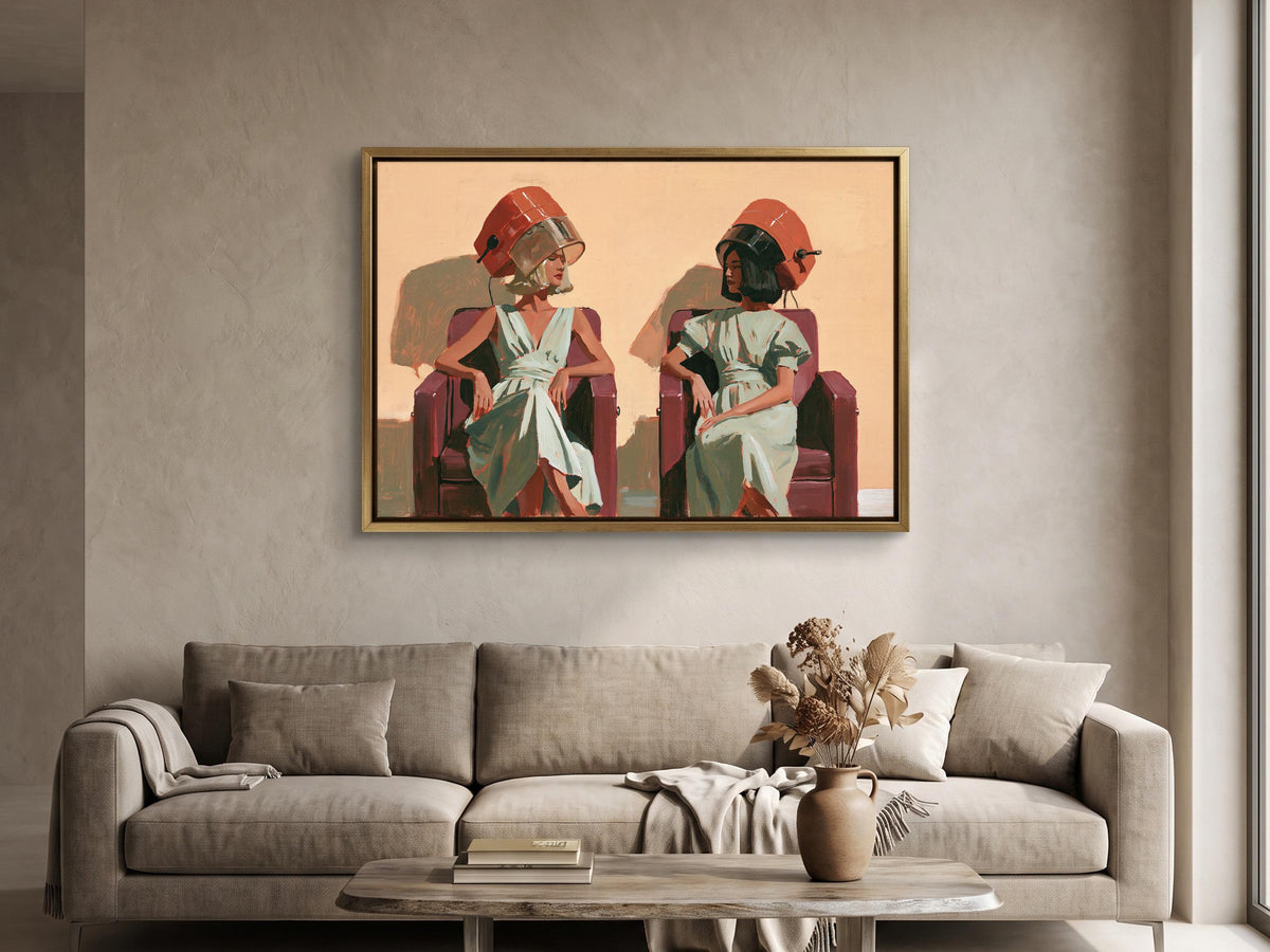 a painting of two women sitting in chairs, with one woman wearing a red hat and the other wearing a green hat. The painting is hung on a wall above a couch in a living room setting.