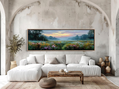 a large, framed painting of a serene landscape with a field of flowers and a colorful sky above. The painting is hung on a wall above a white sofa, which is positioned in front of a wooden coffee table. The room has a modern and minimalist design, with a rug on the floor and some decorative elements such as vases and a potted plant.