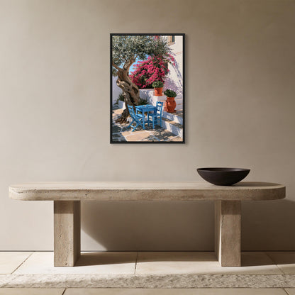 Greek taverna courtyard canvas wall art, serene outdoor patio scene with a tree, a blue chair, and a table with a bowl on