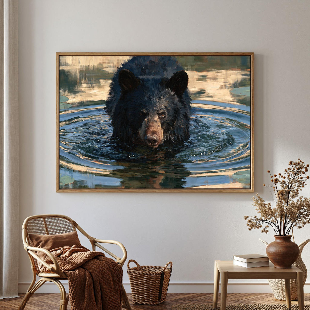 a large framed painting of a black bear swimming in water, hanging on a wall in a room with a wicker chair, a small table with a vase of flowers, and a bookshelf.