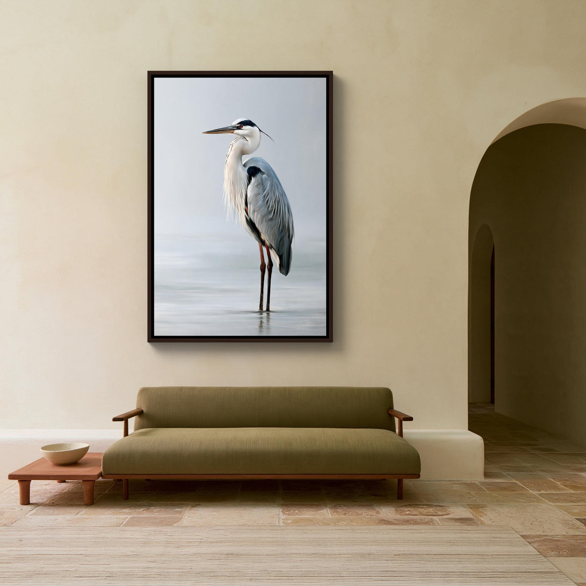 Grey heron in still water canvas wall art, large framed photograph of a heron standing on one leg in a hallway