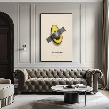 Taped avocado canvas wall art, modern living room with a tufted gray sofa, a round coffee table, and a large framed artwork