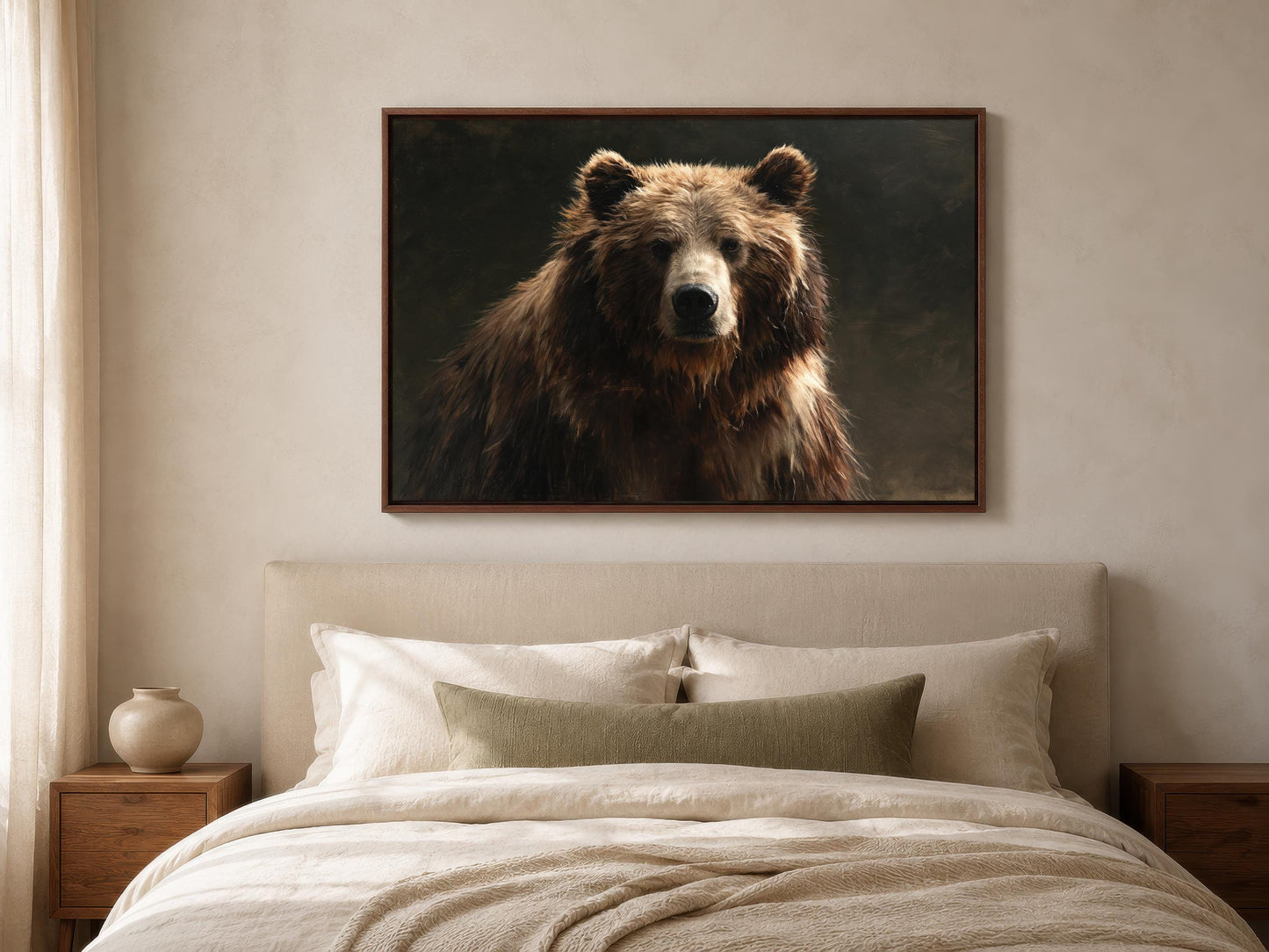 a large brown bear in a dark background, displayed on a wall above a bed with white bedding.