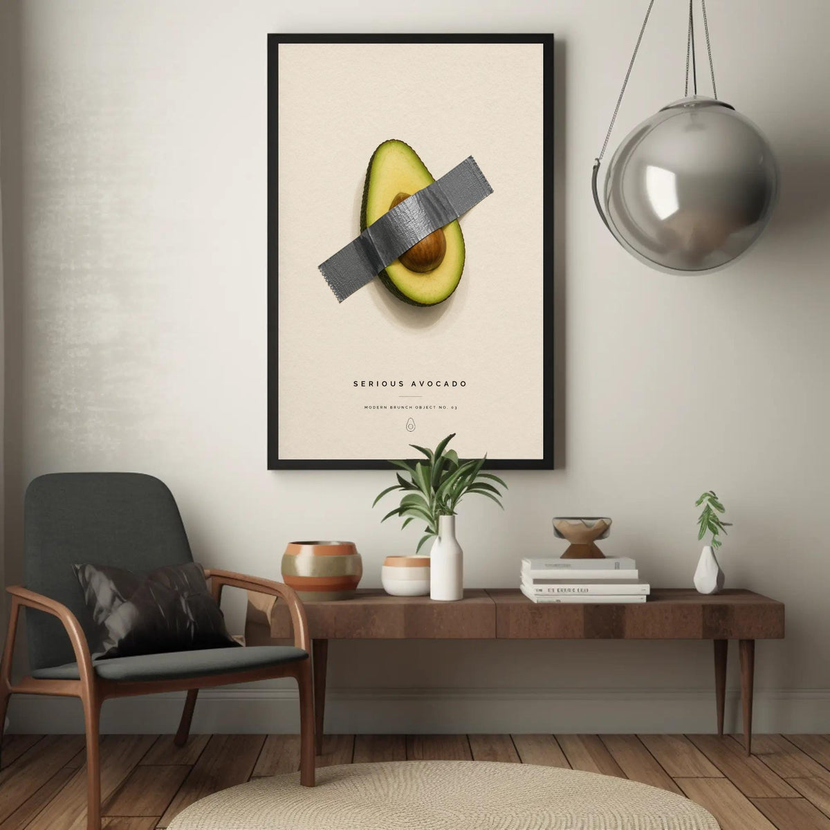 Taped avocado canvas wall art, framed poster of an avocado with a piece of duct tape over it, hanging on a wall in a room