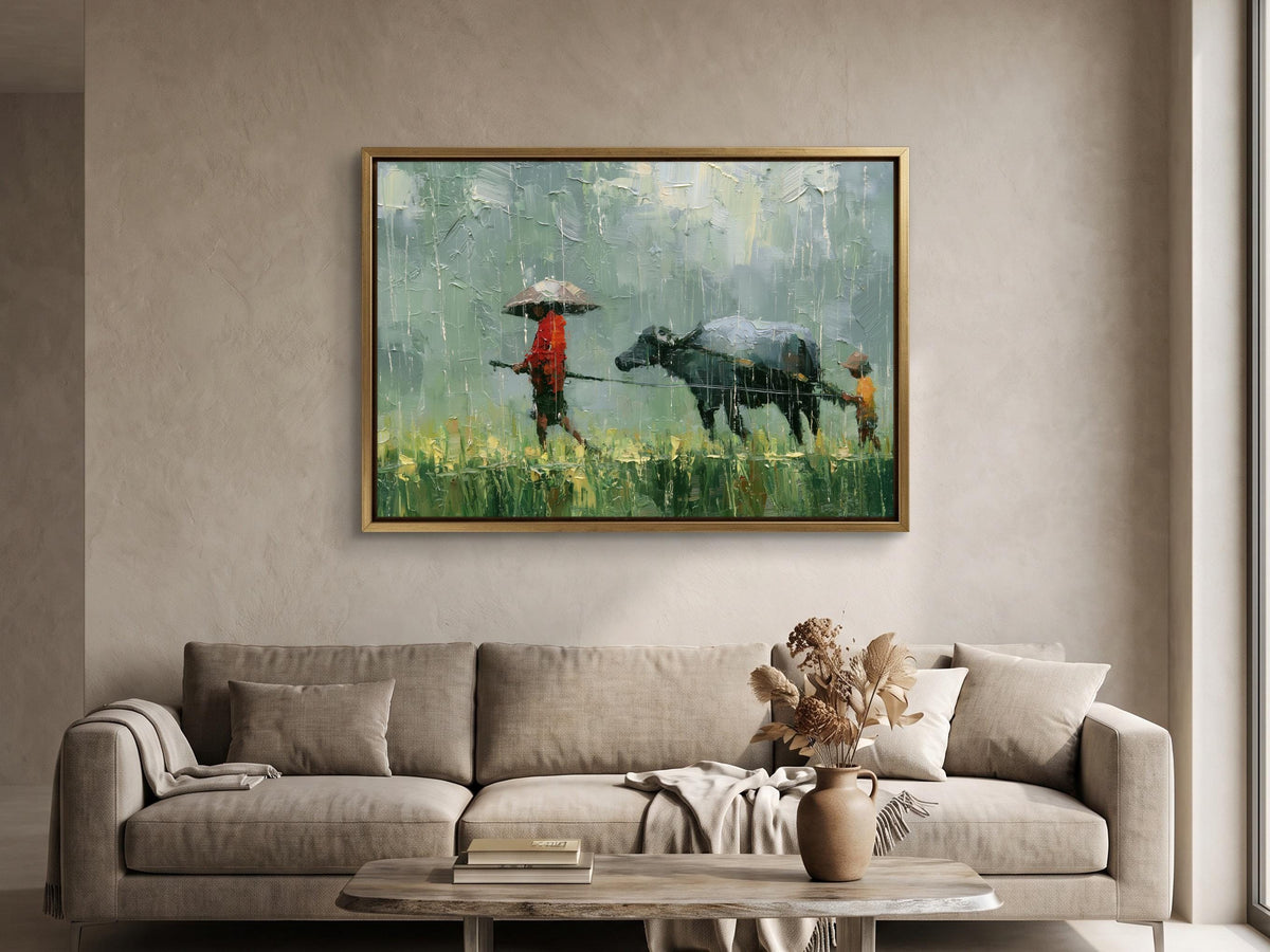 a painting of a person walking with a cow in a field, hanging on a wall above a couch in a living room.