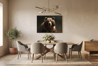 a dining room with a wooden table and six upholstered chairs. Above the table, there is a large painting of a bear on the wall. The room has a neutral color scheme with beige walls and a wooden floor. There is also a potted plant and a vase of flowers on the table, adding a touch of nature to the space.