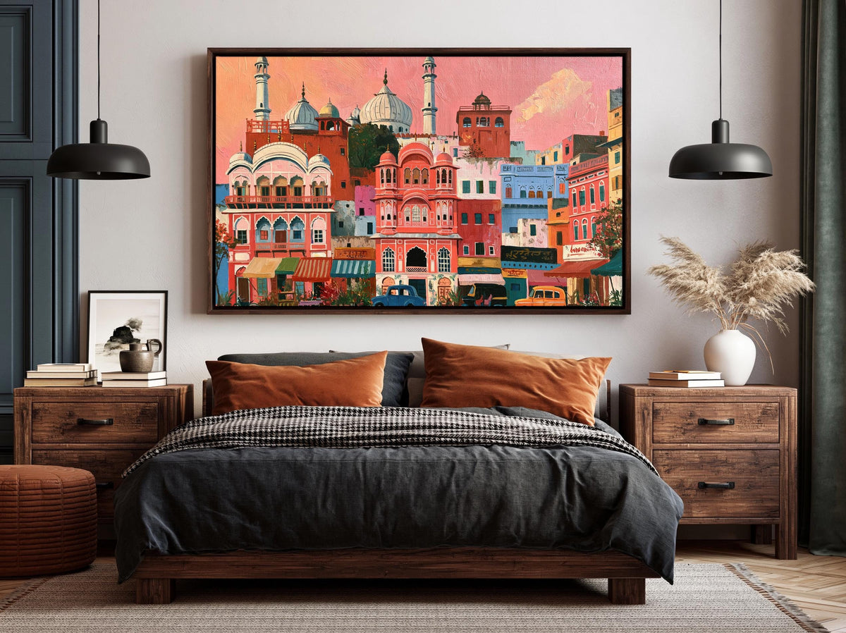 a large, colorful painting of a cityscape hanging on a wall above a bed with a black and gray bedspread.