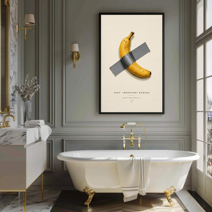 a bathroom with a white freestanding bathtub, a framed poster of a banana taped to the wall, and a marble vanity with a gold faucet.