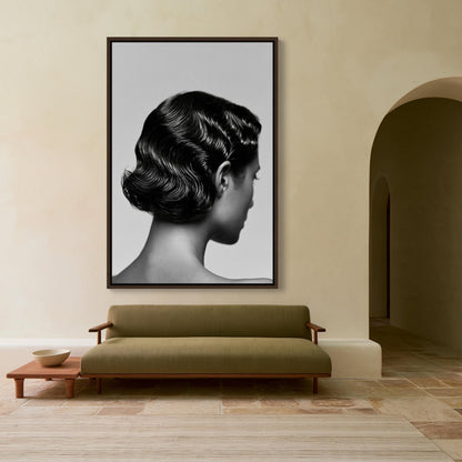 Finger wave hairstyle canvas wall art, large black and white portrait of a woman's face hanging on a wall above a green sofa