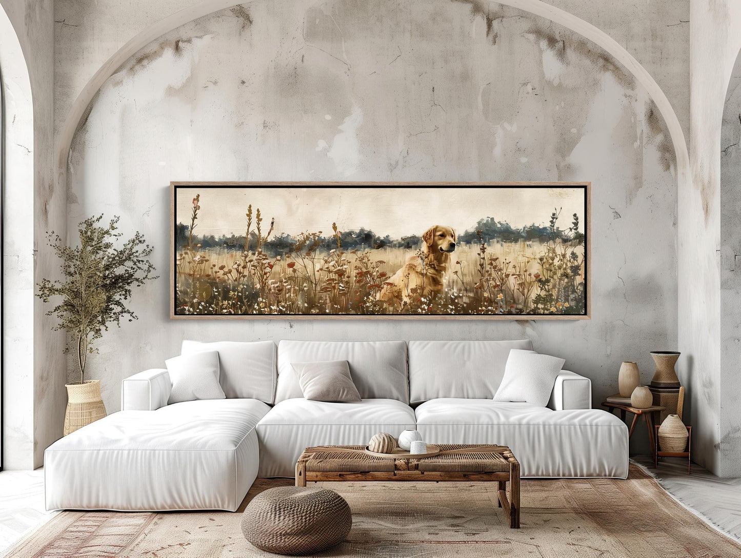 a living room with a couch and a painting on the wall