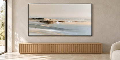 a large landscape painting hanging on a wall above a wooden cabinet or console.