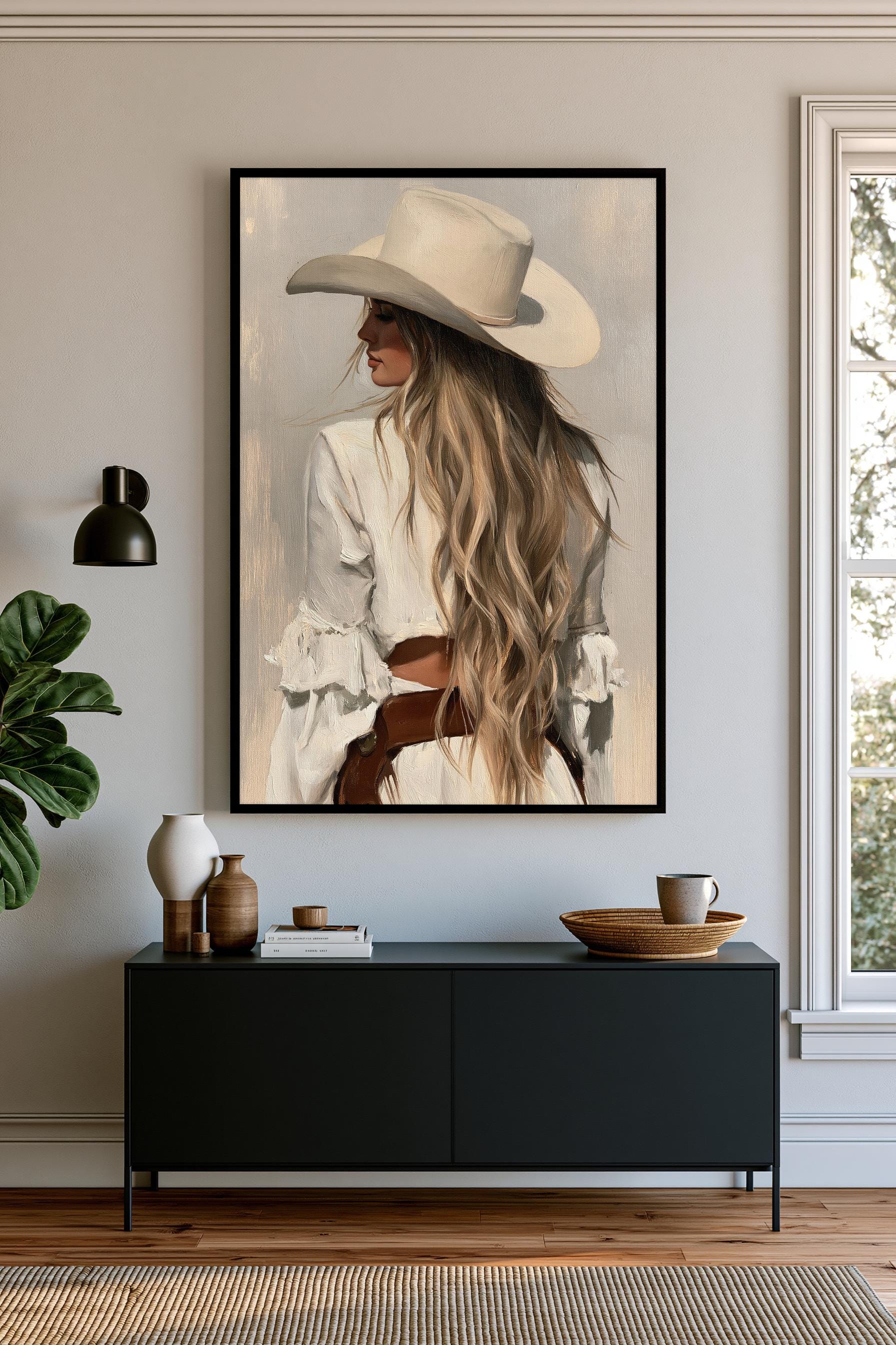 a large framed painting of a woman with long blonde hair wearing a white hat, hanging on a wall above a black console table with various decorative items on it.