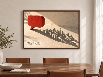 a framed artwork depicting a red speech bubble with a silhouette of a city skyline in the background.