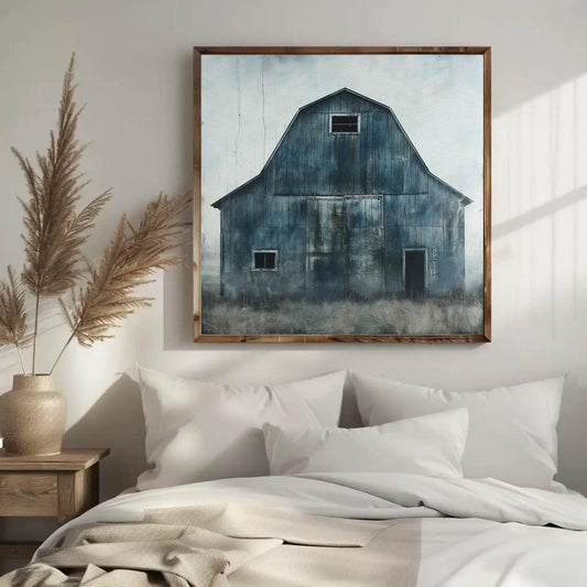 a painting of a barn hangs above a bed