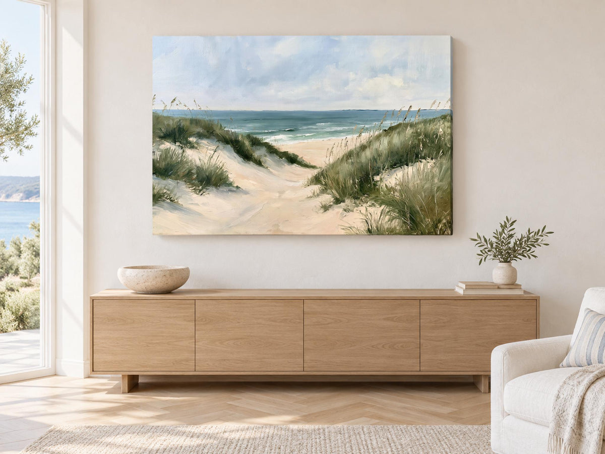 a large painting of a beach scene hanging on a wall in a living room.