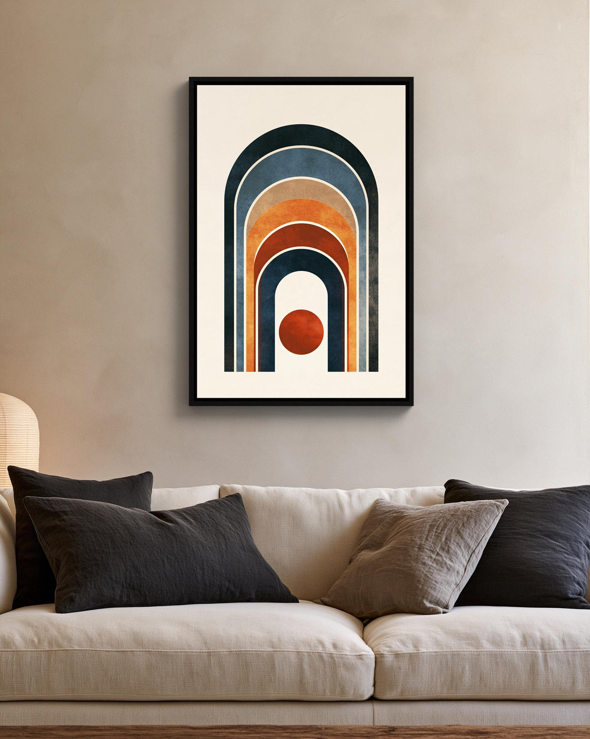 Boho rainbow arch and sun canvas wall art, modern art piece with a geometric design, hanging on a wall above a white couch
