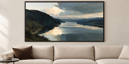 a large landscape painting hanging on a wall above a beige couch in a living room.