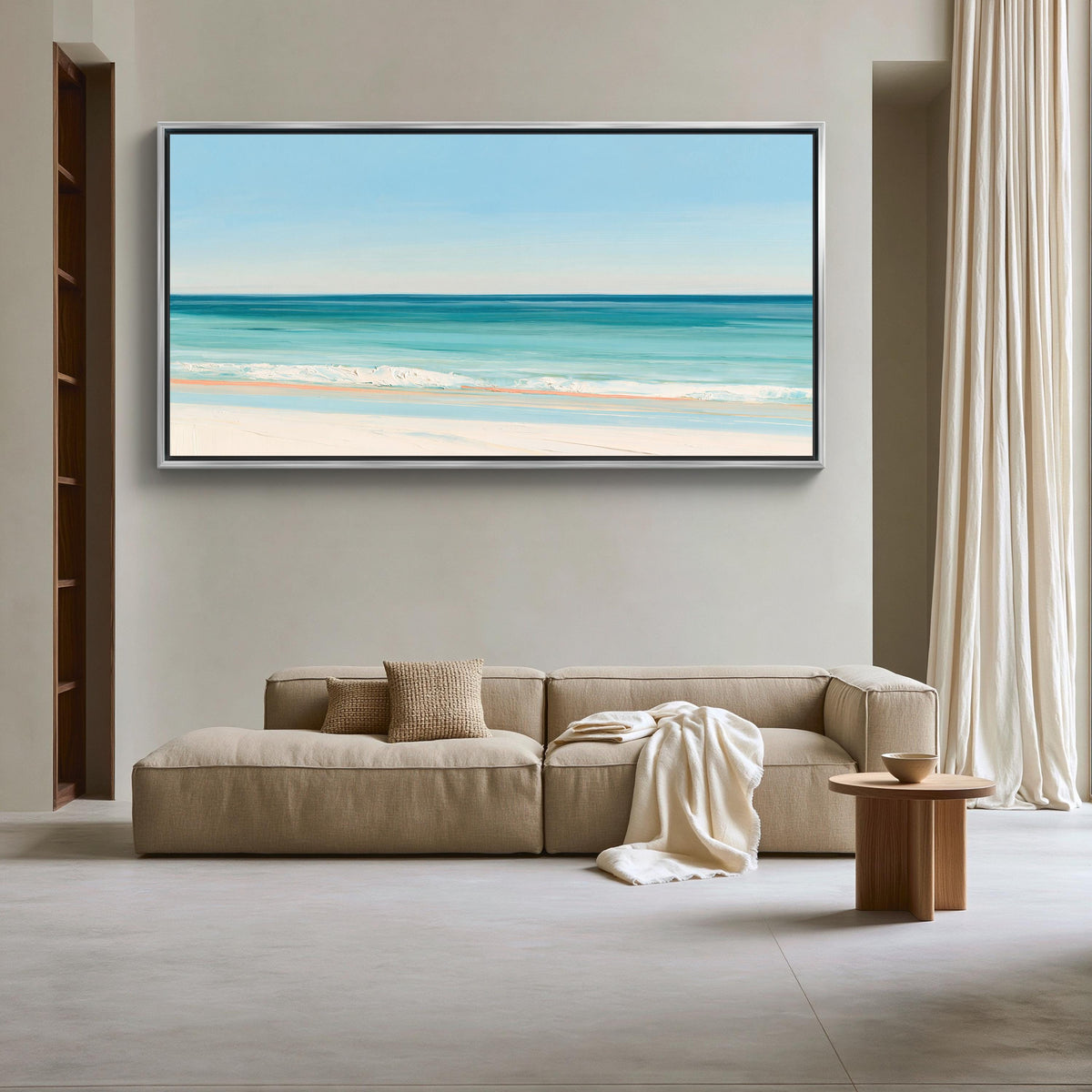 Turquoise ocean beach canvas wall art, large, framed painting of a beach scene hanging on a wall in a living room. The