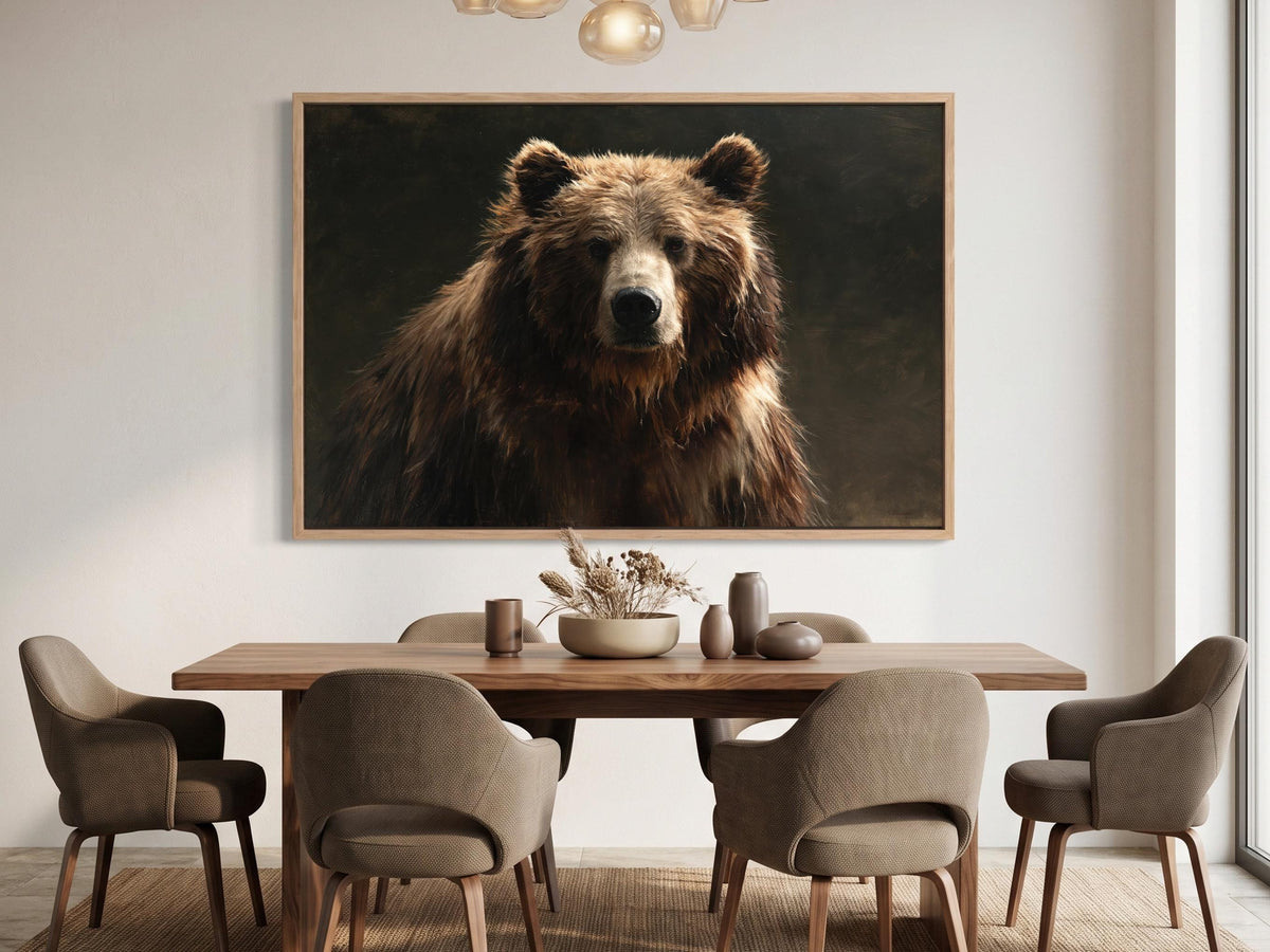 a large brown bear in a dark background, hanging on a wall above a wooden dining table with six chairs.