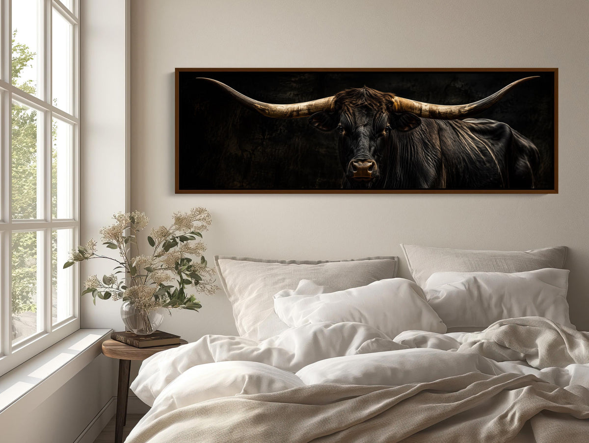 Texas longhorn portrait canvas wall art, large framed picture of a bull with long horns hanging on a wall above a bed with