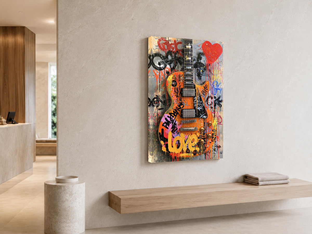 a modern art piece of a guitar with graffiti and the word "love" on it, hanging on a wall in a minimalist setting.