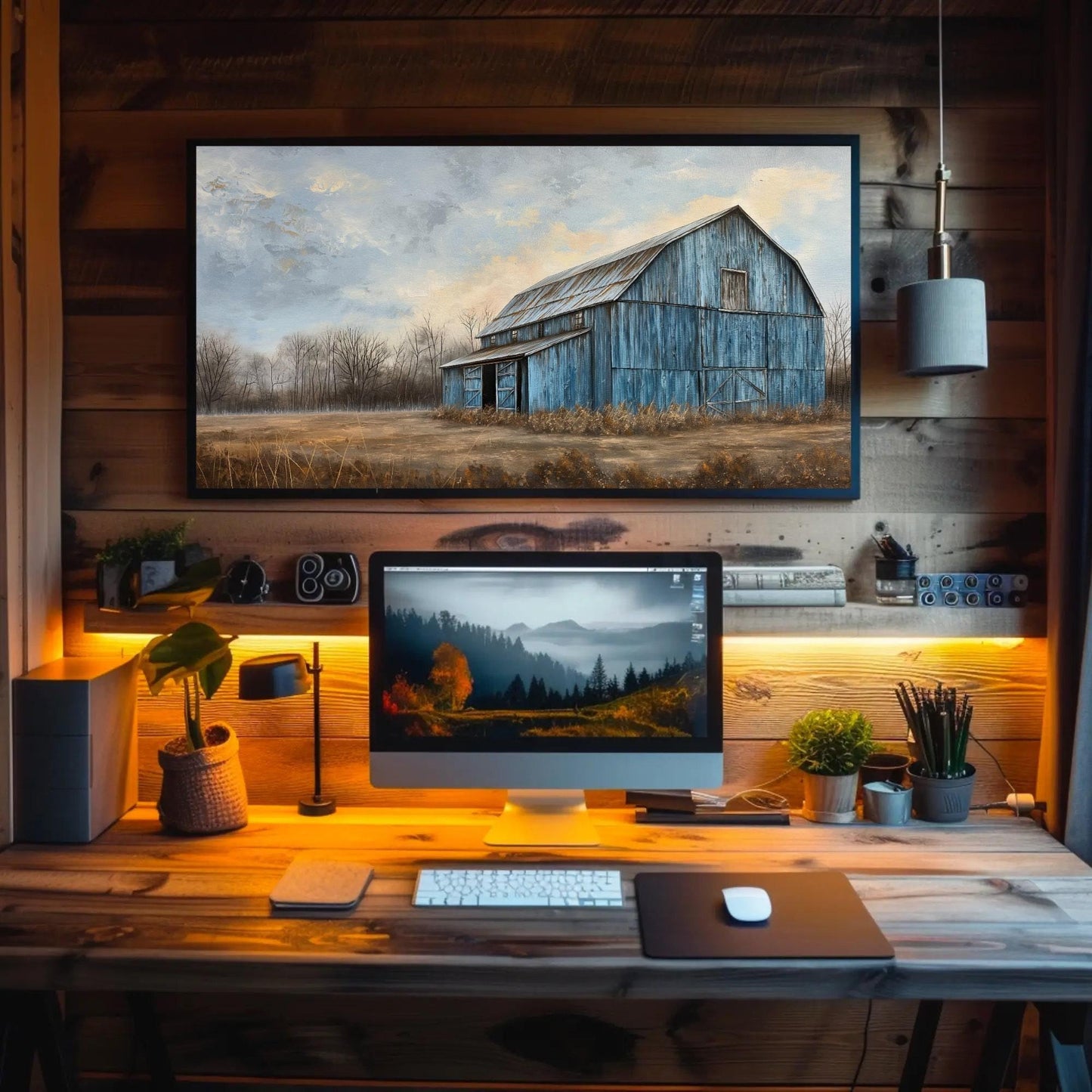 Blue Barn Landscape canvas wall art shown above a desk